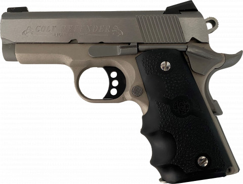 Colt Defender 9mm facing left